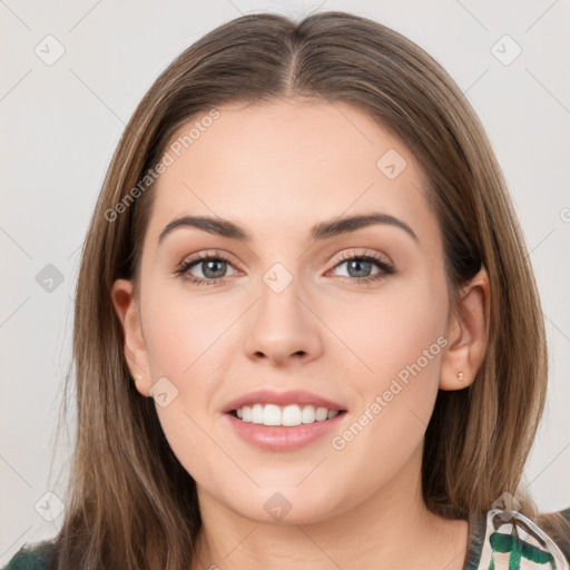 Joyful white young-adult female with long  brown hair and green eyes