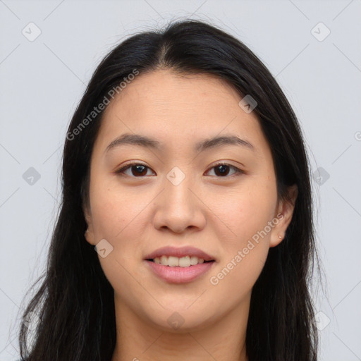 Joyful asian young-adult female with long  brown hair and brown eyes