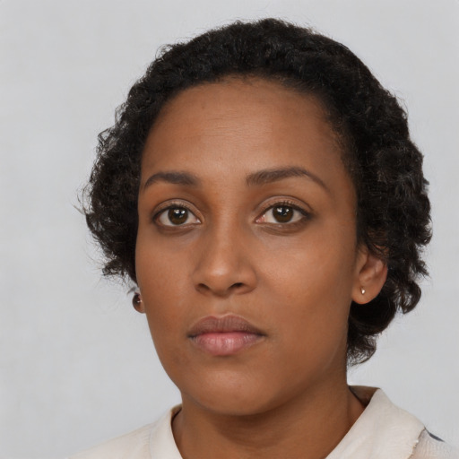 Neutral black young-adult female with short  brown hair and brown eyes