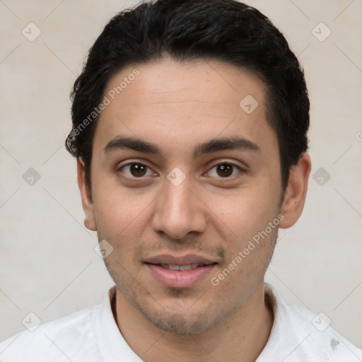 Joyful white young-adult male with short  black hair and brown eyes