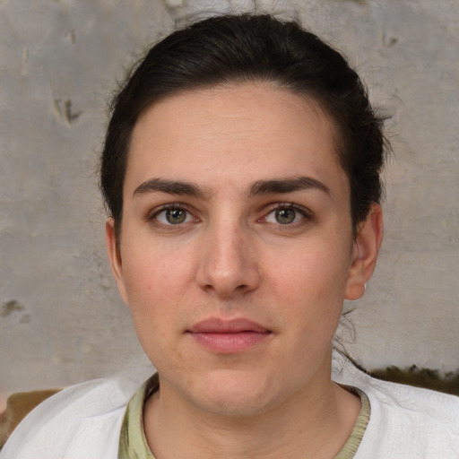 Neutral white young-adult female with short  brown hair and brown eyes