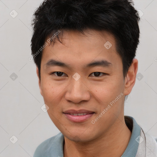 Joyful asian young-adult male with short  brown hair and brown eyes