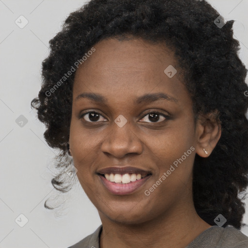 Joyful black young-adult female with medium  black hair and brown eyes