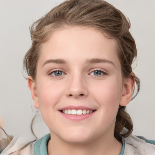 Joyful white child female with medium  brown hair and blue eyes