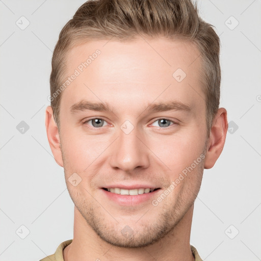 Joyful white young-adult male with short  brown hair and grey eyes