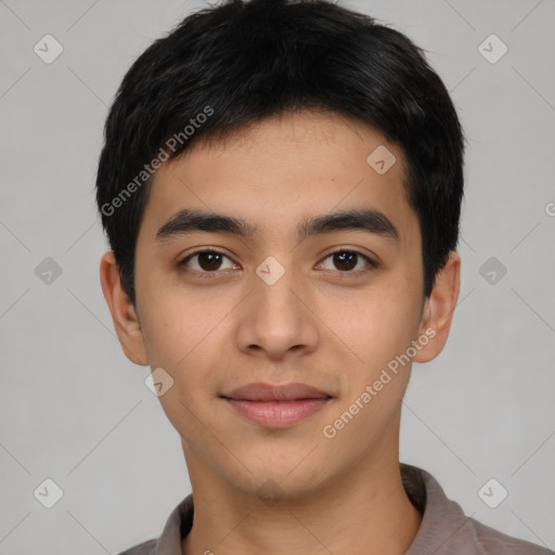 Joyful asian young-adult male with short  black hair and brown eyes