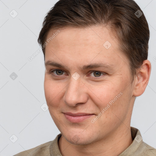 Joyful white young-adult male with short  brown hair and brown eyes