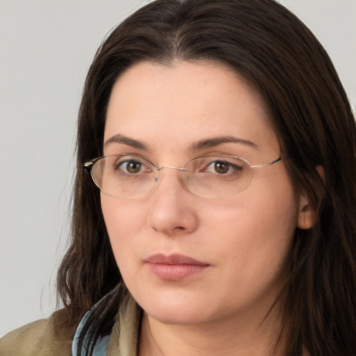 Neutral white young-adult female with long  brown hair and brown eyes