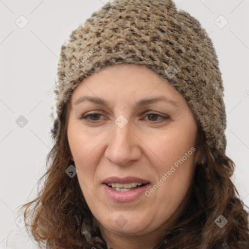 Joyful white adult female with long  brown hair and brown eyes