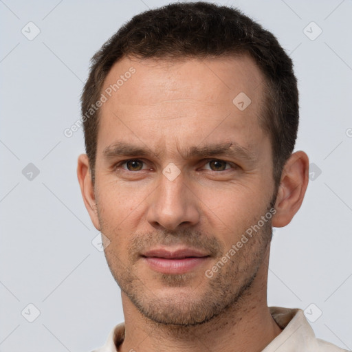 Joyful white adult male with short  brown hair and brown eyes