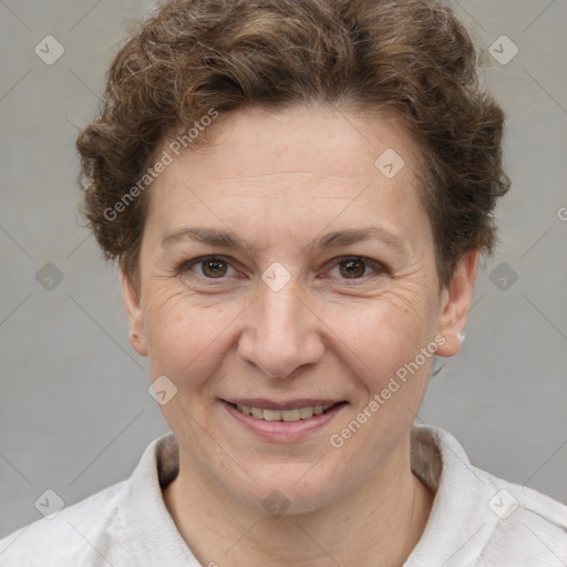 Joyful white adult female with short  brown hair and brown eyes