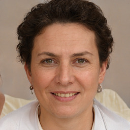 Joyful white adult female with short  brown hair and brown eyes