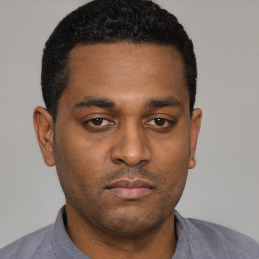 Neutral black young-adult male with short  black hair and brown eyes