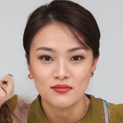 Neutral asian young-adult female with medium  brown hair and brown eyes
