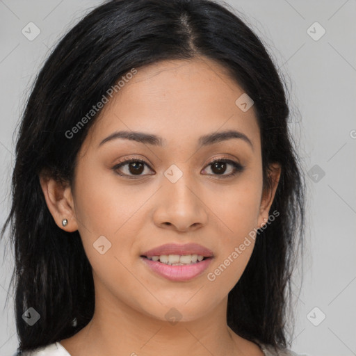 Joyful latino young-adult female with long  brown hair and brown eyes