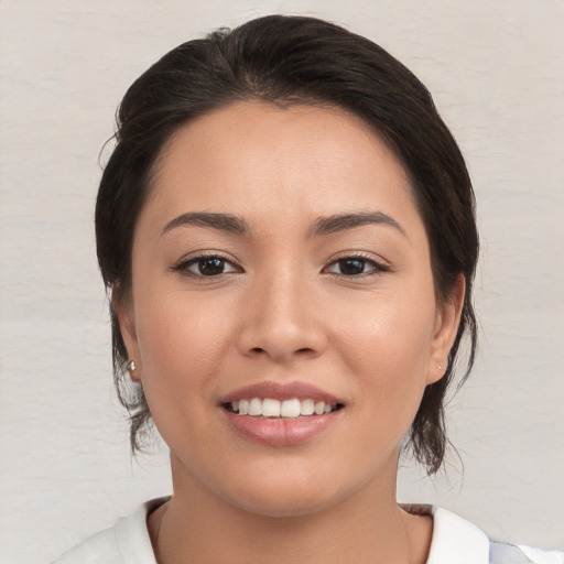 Joyful white young-adult female with medium  brown hair and brown eyes