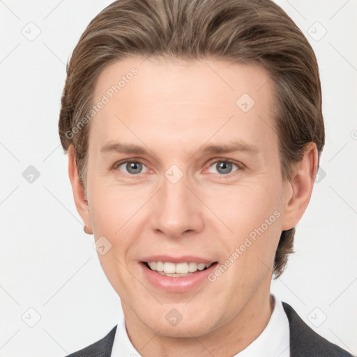 Joyful white adult male with short  brown hair and grey eyes