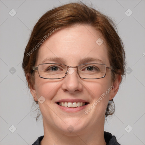 Joyful white adult female with medium  brown hair and blue eyes