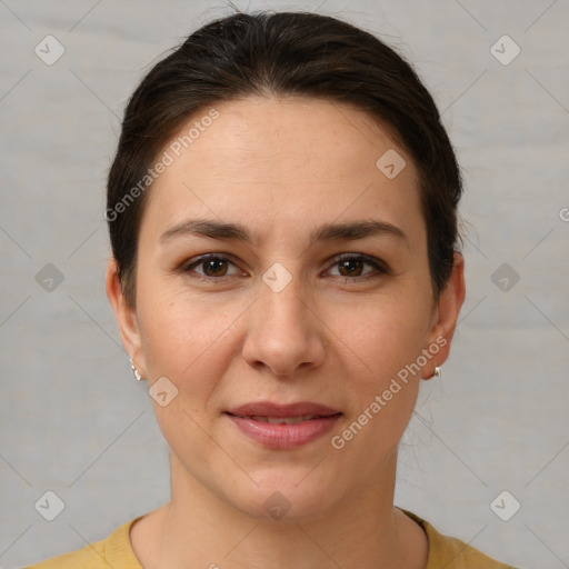 Joyful white young-adult female with short  brown hair and brown eyes