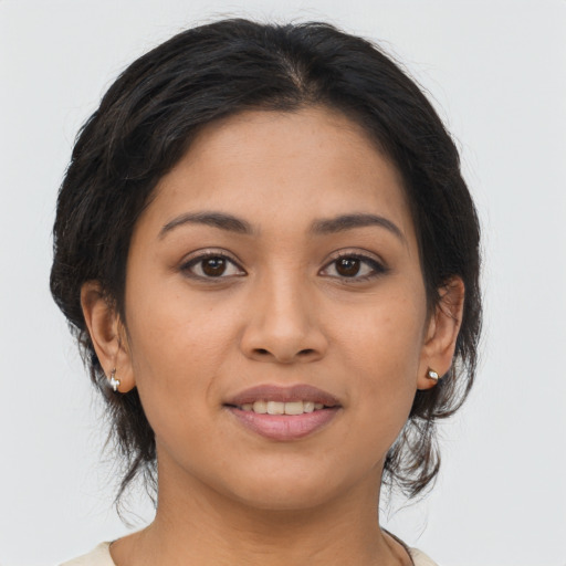 Joyful asian young-adult female with medium  brown hair and brown eyes