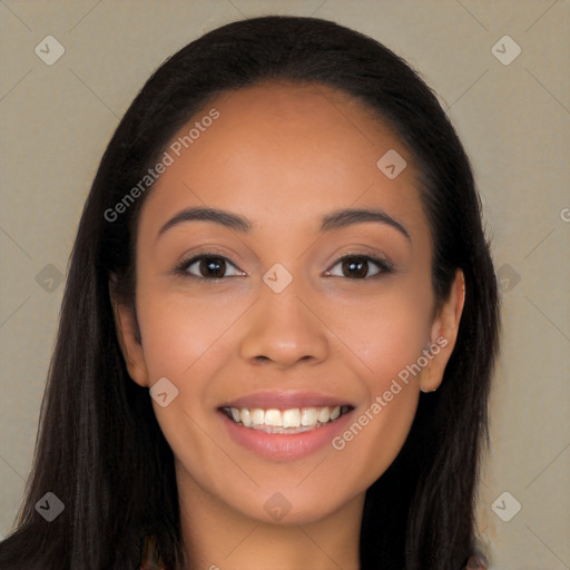 Joyful latino young-adult female with long  brown hair and brown eyes