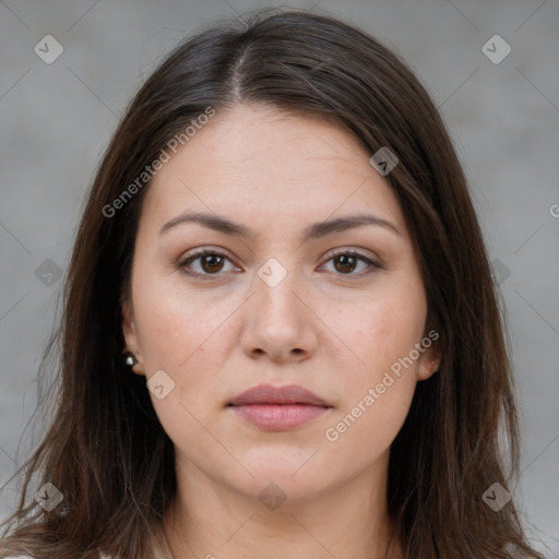 Neutral white young-adult female with long  brown hair and brown eyes