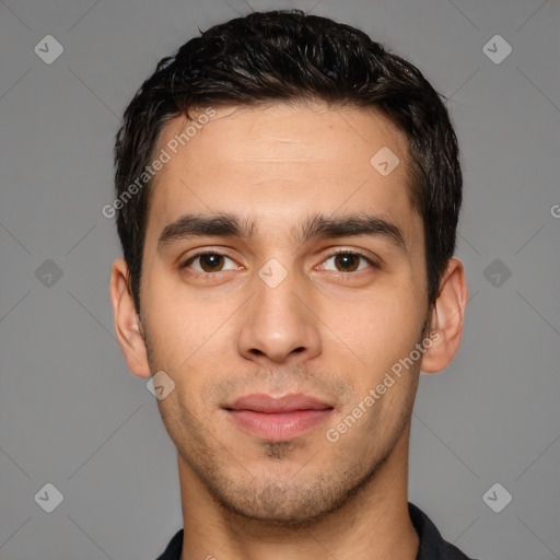 Joyful white young-adult male with short  black hair and brown eyes