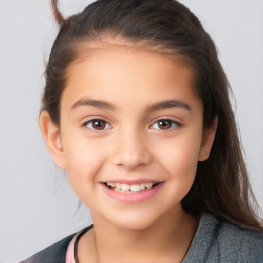 Joyful white child female with long  brown hair and brown eyes