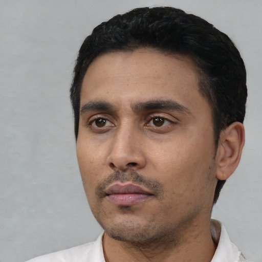 Neutral latino young-adult male with short  black hair and brown eyes