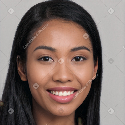 Joyful latino young-adult female with long  black hair and brown eyes