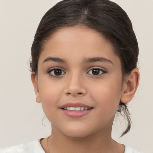 Joyful white child female with medium  brown hair and brown eyes