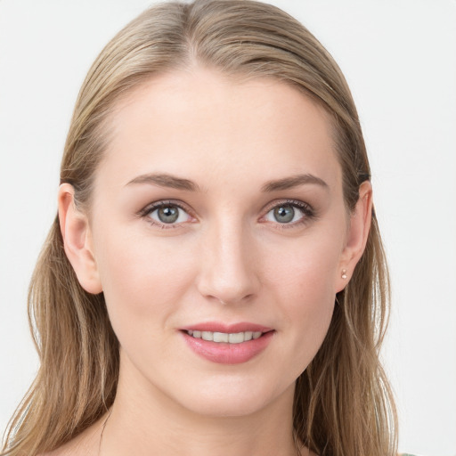 Joyful white young-adult female with long  brown hair and blue eyes