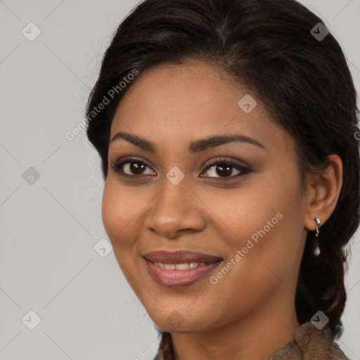 Joyful latino young-adult female with long  brown hair and brown eyes