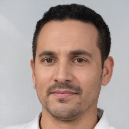 Neutral white adult male with short  black hair and brown eyes