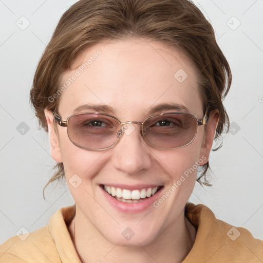 Joyful white young-adult female with medium  brown hair and blue eyes