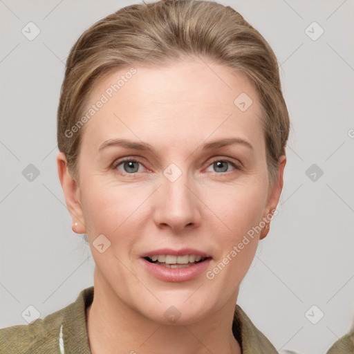 Joyful white adult female with short  brown hair and grey eyes