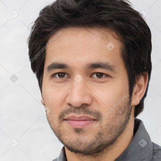 Joyful white young-adult male with short  black hair and brown eyes