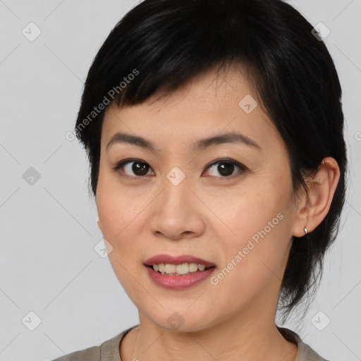 Joyful asian young-adult female with medium  black hair and brown eyes