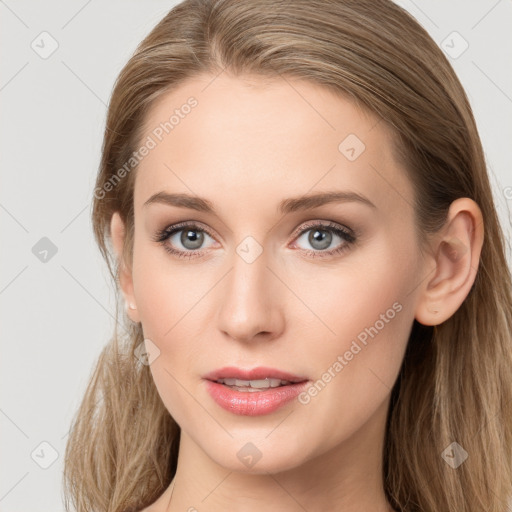 Joyful white young-adult female with long  brown hair and blue eyes