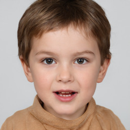 Joyful white child male with short  brown hair and brown eyes