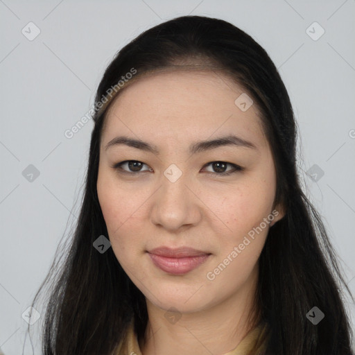 Joyful asian young-adult female with long  brown hair and brown eyes