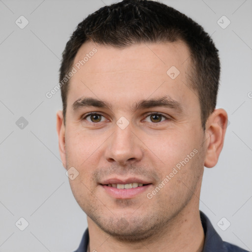 Joyful white young-adult male with short  brown hair and brown eyes