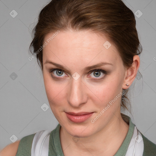 Joyful white young-adult female with medium  brown hair and blue eyes