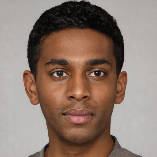 Neutral black young-adult male with short  black hair and brown eyes