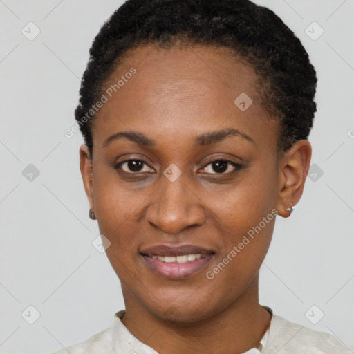 Joyful black young-adult female with short  black hair and brown eyes