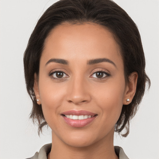 Joyful white young-adult female with medium  brown hair and brown eyes