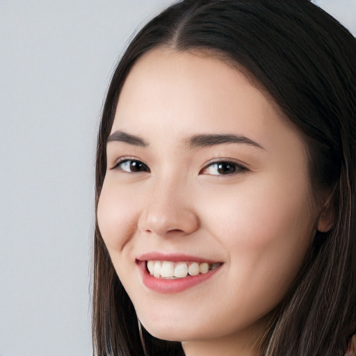 Joyful white young-adult female with long  black hair and brown eyes