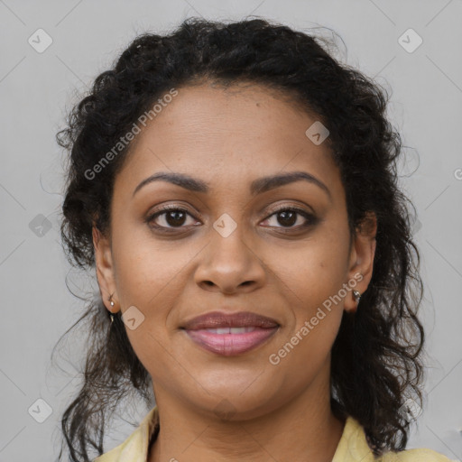 Joyful black young-adult female with long  brown hair and brown eyes