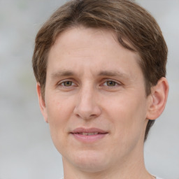 Joyful white adult female with short  brown hair and grey eyes