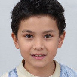 Joyful white child male with short  brown hair and brown eyes